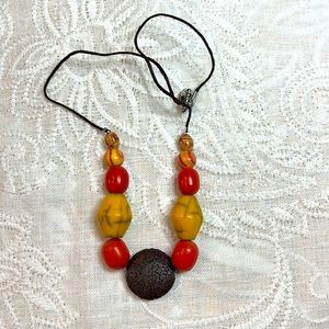 Summertime colors & fun in this 19 ¾” necklace. Chunky beads and lava stone.